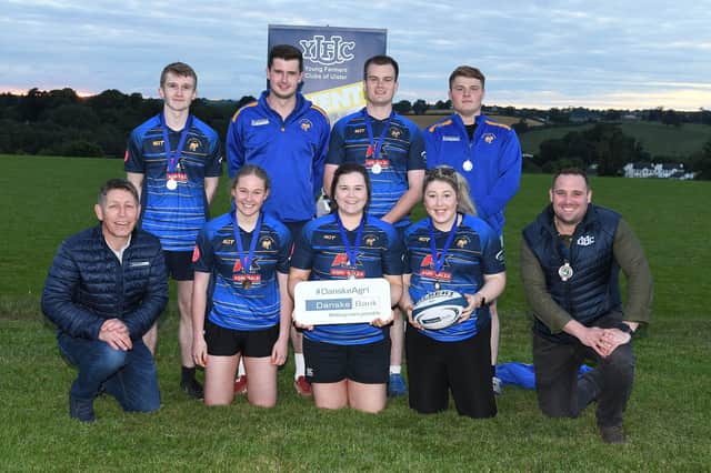 Members of Kilraughts YFC with the Adrian Cooper shield after winning the senior title at the YFCU 2022 tag rugby tournament at Dromore Rugby Club, Co Down. The team are pictured with Rodney Brown, head of agribusiness, Danske Bank (front left) and Peter Alexander, Young Farmers' Clubs of Ulster’s president, (front right)