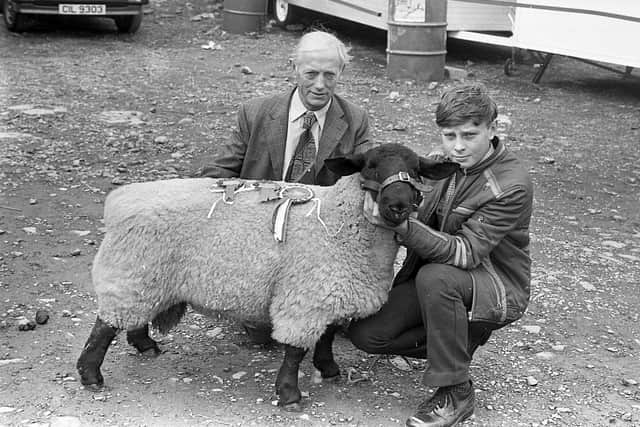 Darel Alcorn from Omagh, Co Tyrone, and Thomas Barbour with the Suffolk champion ram at the Enniskillen (Fermanagh) Show in August 1982. Picture: Farming Life/News Letter archives