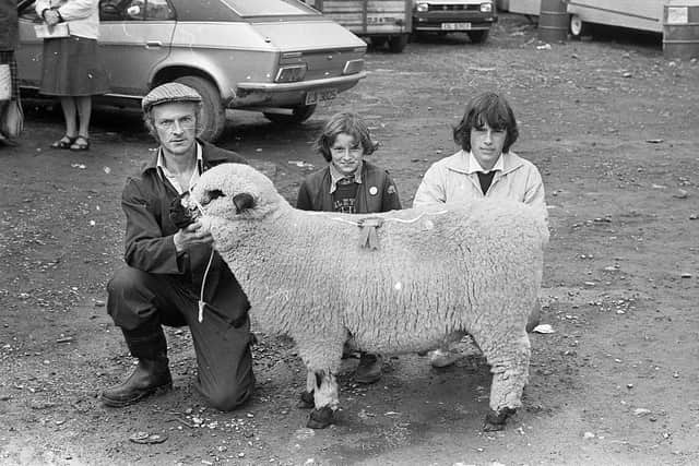 Mr John Killen from Maguiresbridge, Co Fermanagh, with the Hampshire Down champion ram, which was also supreme overall, with Lucy and Claire at the Enniskillen (Fermanagh) Show in August 1982. Picture: Farming Life/News Letter archives