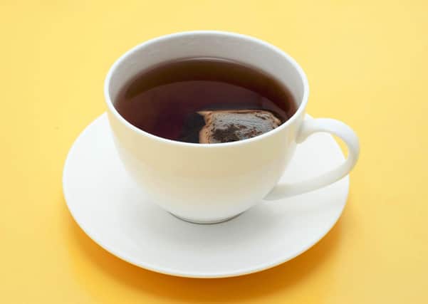 Teabag steeping in a cup of fresh hot tea