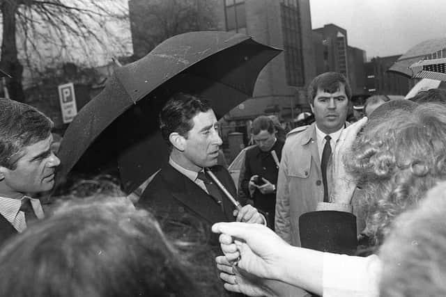 the Prince braves a damp and dull Belfast to meet crowds during his visit. Pictures: Trevor Dickson and Cecil McCausland/News Letter archives