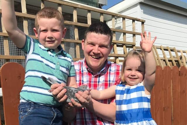 Pictured  5 year old Fionn Mc Cabe with dad Sean and sister Eimhear celebrating having won 1st NorthSouth Fed, 1st Sect &  1st Open NIPA Tullamore 19,155 birds competing