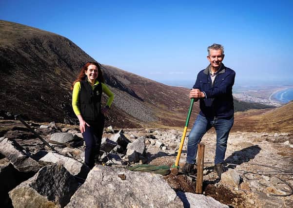 Environment Minister Edwin Poots MLA and Heather McLachlan, National Trust’s Director for Northern Ireland, pictured on Slieve Donard in the Mourne Mountins, where the Minister helped National Trust staff and volunteers repair a strategic path leading from ‘the saddle’ to the summit using innovative and sustainable methods. Minister Poots has announced a further £2million for environmental projects through an Environmental Challenge Competition, one of three strands of the Environment Fund (EF). Photo Kelvin Boyes/PressEye