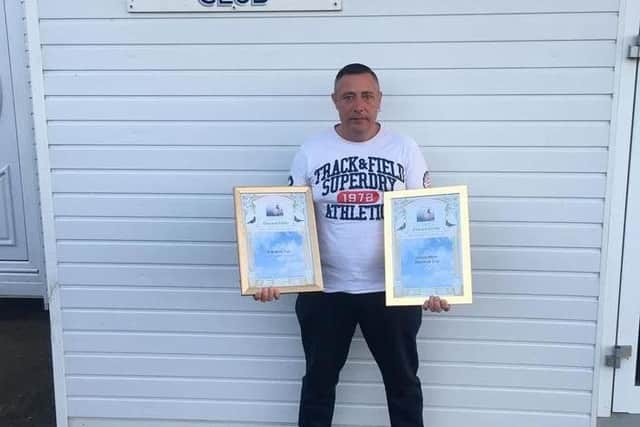 Jason Parke from the Windsor Social holding his awards won last year from St Malo, finishing 2nd Open NIPA in the Old Bird National (France).