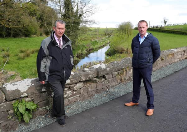 Environment Minister Edwin Poots MLA has appealed to the public, farmers and business owners to be respectful of waterways and be mindful of the devastating effects of pollution. Minister Poots is pictured with Seamus Cullinan, Senior Fisheries Officer Loughs Agency, at the River Aghlisk in County Tyrone, where thousands of fish died following a pollution incident. Photo Kelvin Boyes/PressEye