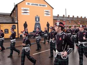 A flute band marches past a UDA mural at a Remembrance Day ceremony in Sandy Row, Belfast, in May 2007. Picture: Justin Kernoghan/Photopress Belfast