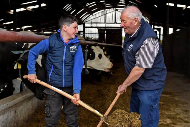 John Og Darragh, left, who was nominated by Karen McGahan, is pictured helping out his grandfather John Cassley on the farm.