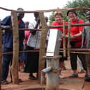 Dr Dickie Barr with his wife Janice at the borehole built with the help of Charlene's Project in Uganda