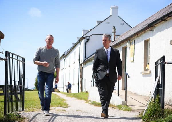 Minister Poots meets with chairman of Rathlin Development and Community Association, Michael Cecil to hear about the island’s long term goal go Carbon neutral and test emerging renewable technologies on the Island. Photo by Kelvin Boyes / Press Eye