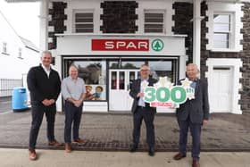 Owners of SPAR Coagh, Andy Davis and Graham Johnson celebrate the store being the 300th SPAR to open in Northern Ireland, with Henderson Group Joint Managing Director, Martin Agnew and Chairman, John Agnew