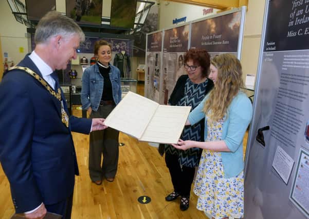 The Mayor of Causeway Coast and Glens Borough Council Alderman Mark Fielding views some of the material on display in the Partition in Ireland: Partition of Ulster exhibition at Ballymoney Museum with Helen Perry, Jamie Austin from Museum Services and Nina McNeary.