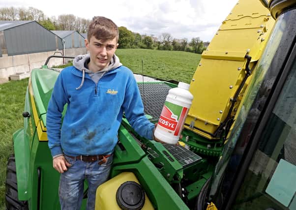 Adam Lee of Belllanaleck with the Ultra Low Volume Ecosyl silage additive applicator on a Lee Agri Contracts self propelled John Deere harvester.  An innovation that adds value to winter feed for customers and saves precious time making silage under Co Fermanagh conditions.  Using an Ultra Low Volume applicator only two litres of water are needed to treat 100 tonnes of forage compared to at least 100 litres of water with the conventional system.