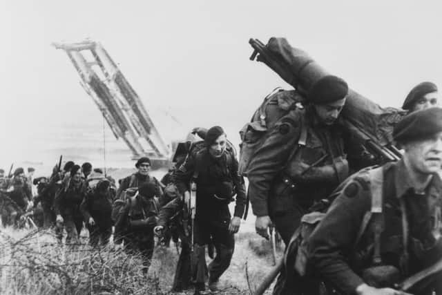 Royal Marine Commandos moving off the Normandy Beaches during the advance inland from “Sword” beach. Picture: PA Wire