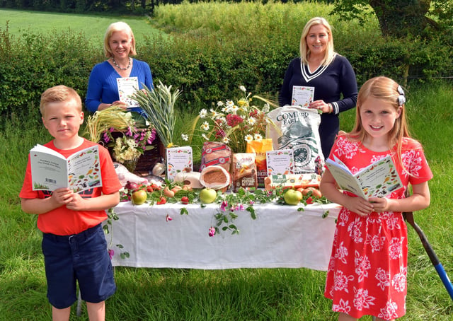 Sister and brother, Grace and Robert Wilson (Age 8 and 7), Muckamore, Co. Antrim with Josephine Kelly, Acting CEO of AFBI who launched the science-based and curriculum-linked educational resource ‘Northern Ireland: Our Food, Our Story’ for all Northern Ireland Primary Schools, with its author Dr. Vanessa Woods