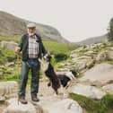 National Trust conacre farmer John Maginn pictured with his sheepdogs on Slieve Donard. National Trust images/Paul Moane