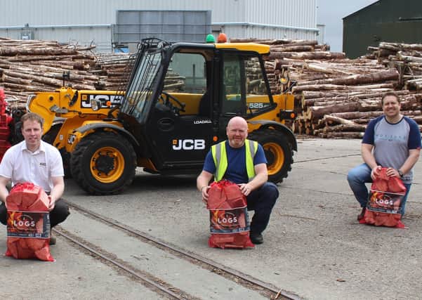 Discussing the benefits of the JCB 525-60 telehandler: l to r Jeremy Gillan, Link Logs; Jeff Haslett; Dennison JCB and Ricky Wright, CEO Vineyard Compassion