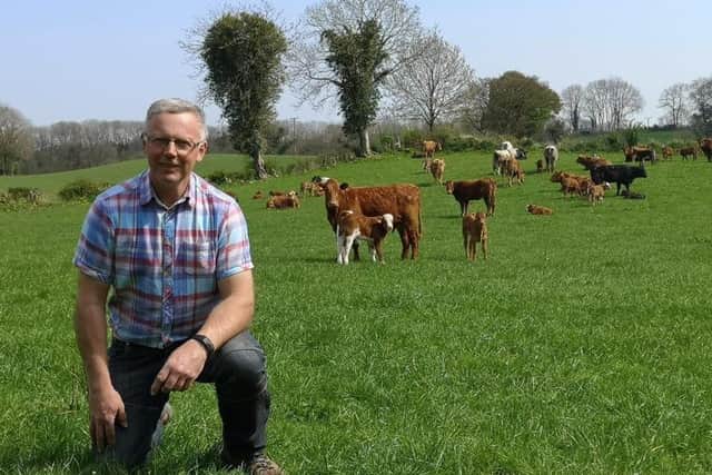John Egerton pictured with some of his spring calving cows and calves,