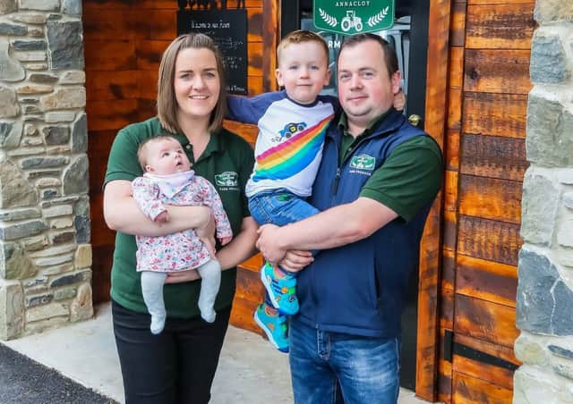Karrane and Malachy McGrath with their son Niall and baby daughter Sarah outside their new farm shop