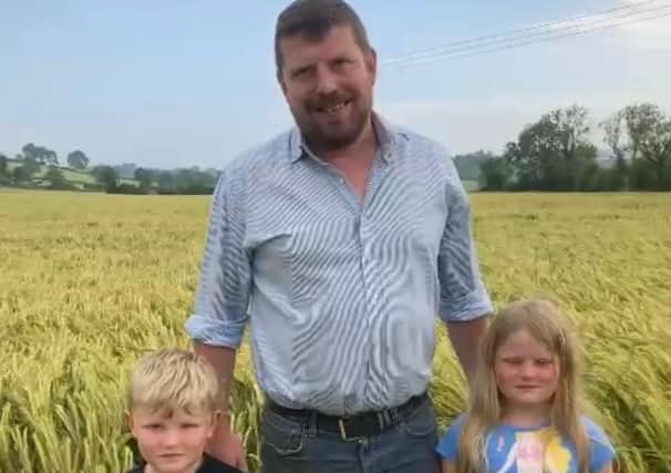 Pictured in the field of winter barley, Robert Copeland from the UFU South West Down Group and his children Ernie and Katie, who was placed third in the 2021 UFU winter barley cereal competition.