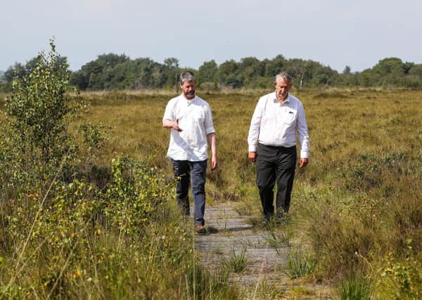 Environment Minister Edwin Poots is pictured with Matthew Aikenhead, soil scientist at the Hutton Institute at a recent visit to Peatlands Park, Dungannon ahead of International Bog Day on 25 July.