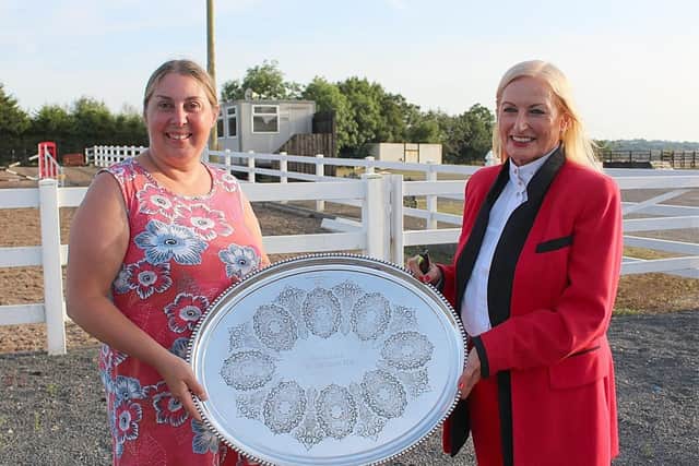 Sarah McCob presents Joan Cunningham with the silver tray to be presented to the winner of the traditional Cob class at the show on Saturday, August 14th