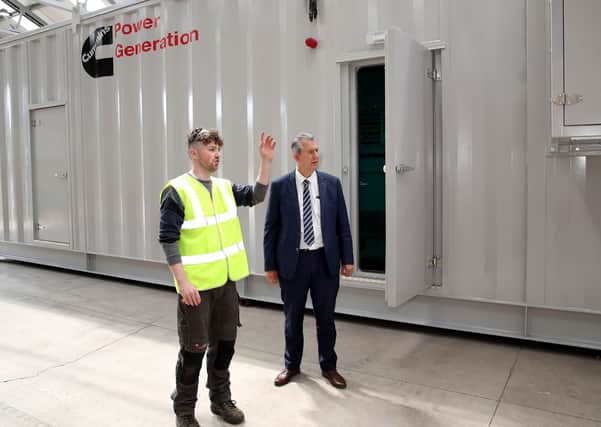 DAERA Minister Edwin Poots MLA pictured with Joshua O'Neill from 160B Consulting Ltd as he shows the Minister how innovative engineering equipment which was funded under DAERA's Rural Micro Business Growth Scheme helped transform their rural business at Old Brickworks, Dungannon.