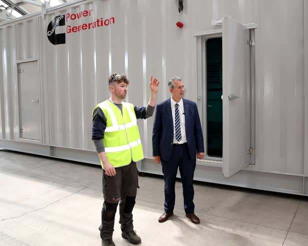 DAERA Minister Edwin Poots MLA pictured with Joshua O'Neill from 160B Consulting Ltd as he shows the Minister how innovative engineering equipment which was funded under DAERA's Rural Micro Business Growth Scheme helped transform their rural business at Old Brickworks, Dungannon.