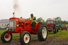 Councillor Mervyn Rea from Crumlin on his Allis Chalmers tractor, at the vintage tractor and classic car road run, hosted by Loanends Presbyterian Church.