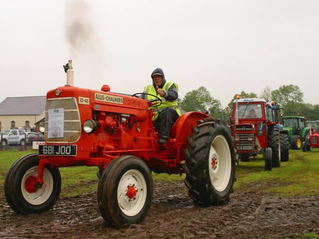 Councillor Mervyn Rea from Crumlin on his Allis Chalmers tractor, at the vintage tractor and classic car road run, hosted by Loanends Presbyterian Church.