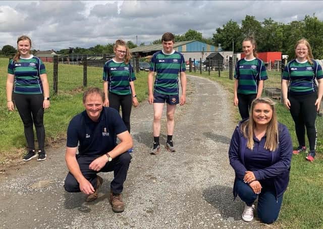 David Brown, deputy president of the Ulster Farmers’ Union with Susan Bate, membership & club development officer for the Young Farmers’ Clubs of Ulster with Annaclone & Magherally YFC pictured on Blackberry Hill Farm