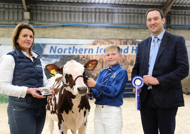 Alison Beattie, Farm Wardrobe, has confirmed continued sponsorship of the Ayrshire showmanship classes at the Multi-Breed Dairy Calf Show. She is pictured at the 2019 event with reserve champion handler Camerson Carson,and judge Iwan Thomas. Picture: Jane Steel