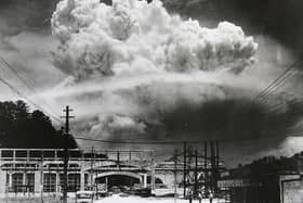 View of the radioactive plume from the bomb dropped on Nagasaki City, as seen from 9.6 km away, in Koyagi-jima, Japan, August 9, 1945. The US B-29 superfortress Bockscar dropped the atomic bomb nicknamed 'Fat Man,' which detonated above the ground, on northern part of Nagasaki City just after 11am. (Photo by Hiromichi Matsuda/Handout from Nagasaki Atomic Bomb Museum/Getty Images)