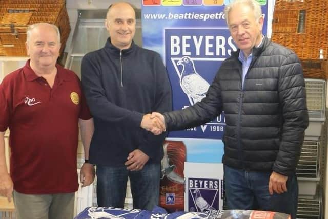 Cyril Beattie on behalf of Beyers, presenting the sponsorship to Fred Russel and Gregory McEvoy from NIPA