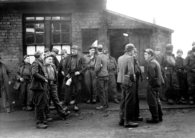 Workers at Whitehaven, Cumbria, where an explosion has trapped miners in the undersea workings of the Lowca No 10 pit in August 1947. Picture: PA