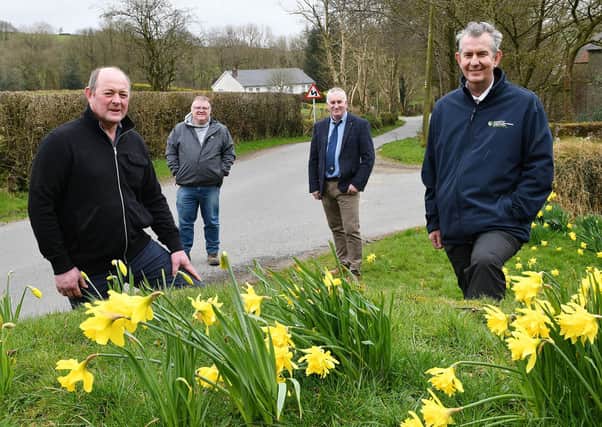 DAERA Minister Edwin Poots MLA is pictured visiting one of the impacted farms in March this year (L-R) farm owner Drew Fleming, Declan McAleer MLA and President of the Ulster Farmers' Union Victor Chestnutt.