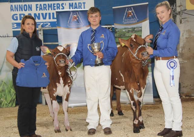 Allison Beattie, Farm Wardrobe, congratulates brother and sister Jack and Amy King, winners of the champion and reserve Ayrshire showmanship awards at the 18th Multi-Breed Dairy Calf Show, held in Dungannon. Picture: Julie Hazelton