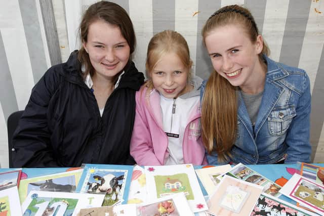 Bella-Jane Beattie, Abigail McNeill and Alice McNeill having fun at the United Parthenaise Cattle Society Show in Garvagh in August 2010