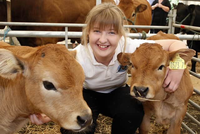 Shelly-Jo McClarty pictured with two of her calves at the United Parthenaise Cattle Society show at Garvagh  in August 2010