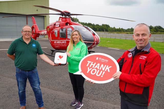 Mark Baillie of MKB Medical and Bronagh Luke from Henderson Group are pictured with the defibrillator they have donated to Air Ambulance NI with Glenn Oâ€TMRorke, Operational Lead Paramedic with the Helicopter Emergency Medical Service. The new device will reside outside the organisationâ€TMs headquarters on Halftown Road in Lisburn, registered to The Circuit and available 24/7 should it be needed locally.
Photo by Aaron McCracken