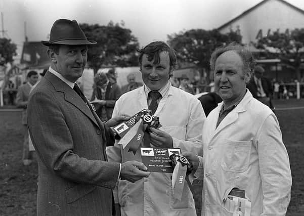 Major General E G D Pounds. Chief executive of the British Friesian Cattle Society, handing over the societyâ€TMs awards to exhibitors of the champions at the Balmoral Show in 1981. They included Mr Austen Alexander, supreme, and Mr David Heenan, reserve. Picture: Farming Life archives