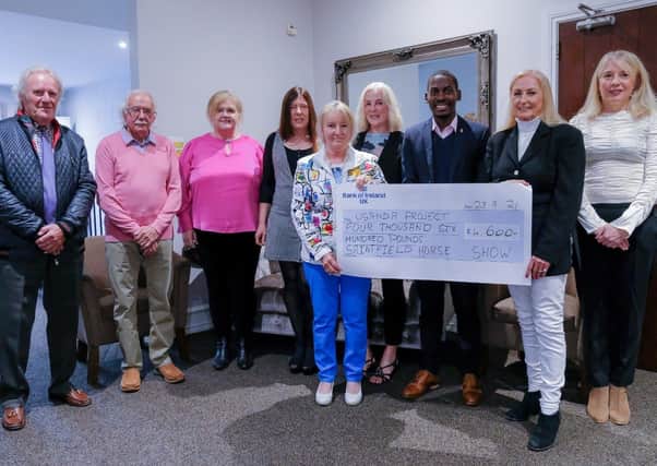 Saintfield Horse Show director Joan Cunningham and the Saintfield Horse Show team presented a cheque for £4,600 at the Temple Golf Club last Thursday evening. The money raised will go towards the Ugandan Project. From left, Derek Spencer, Robin Patterson, Elma Newberry, Mandy Price, Vi Patterson, Angela Cartright, Pius Kulama, Joan Cunningham and Iona McCreery