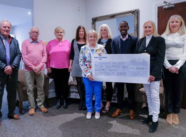 Saintfield Horse Show director Joan Cunningham and the Saintfield Horse Show team presented a cheque for £4,600 at the Temple Golf Club last Thursday evening. The money raised will go towards the Ugandan Project. From left, Derek Spencer, Robin Patterson, Elma Newberry, Mandy Price, Vi Patterson, Angela Cartright, Pius Kulama, Joan Cunningham and Iona McCreery