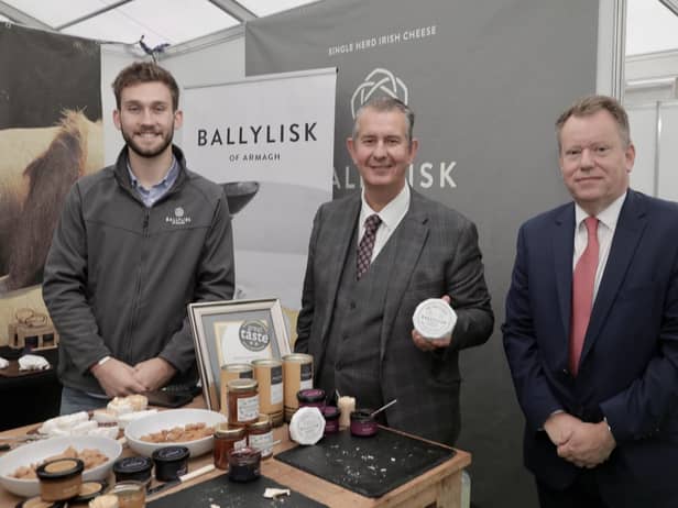 DAERA Minsiter Edwin Poots MLA and Defra Secretary of State George Eustice view some of the excellent produce available from Northern Ireland on display at the Balmoral Show. Pictured (from left-right) are; James Wright of award winning cheese company Ballylisk Dairies Ltd, Co Armagh, DAERA Minister Edwin Poots MLA and Defra Secretary of State George Eustice
