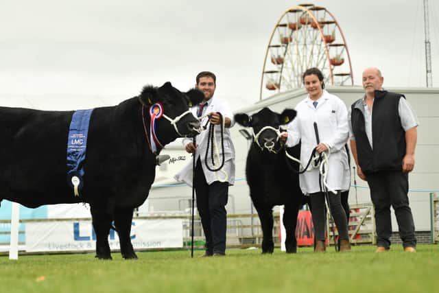 The supreme Aberdeen Angus champion and overall interbreed beef champion at the 152nd Balmoral Show was Woodvale Miss Annie U436 bred by the Armour family from Dromara. Pictured, from left: Adam Armour, Cathy Holmes and Alwyn Armour. Picture: Alfie Shaw
