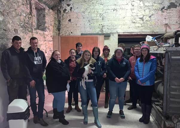 Some of the members from Newtownards YFC with Jessica Lee, YFCU farm safety mentor, at Jay Wardens farm at the Farm Safety meeting last week