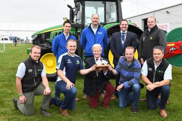 Sam Graham from Killinchy YFC and Matthew Cleland from Spa YFC on winning first place for Co Down in the machinery handling competition at Balmoral Show 2021. Left to right, sponsor Johnston Gilpin Ltd, CAFRE, William Richmond and Selwyn Graham, Ian Harvey MBE, YFCU president Peter Alexander, sponsor Johnston Gilpin Ltd and John Deere representative