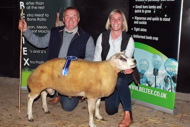 Janice Preston with Kenny and Janice Preston's class winning Ram Lamb, Glenpark Gerald ET, Lot 49, along with judge, Brendan McQuaid.
