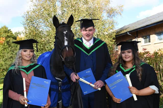 Foundation Degree in Equine Management 2021 graduates Rebecca Reddin, Dublin; Ian Hyland, Co Kildare and Aimee Brolly, Co Donegal celebrate their graduation from CAFRE Enniskillen Campus.