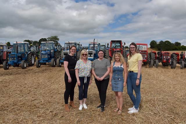 Donaghmore NS Staff in  front of Robin Long's Tractors. From left are Shauna Kelly, Alma Pearson, Wendy Long, Gillian Borland and Lynette Magee at the Elaine McGlinchey Memorial Tractor Run