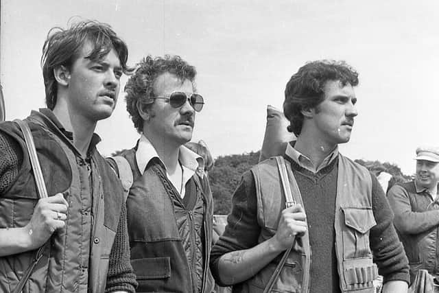 Kircubbin clay pigeon men Robert Sinclair and Tommy Telford and a friend watching the shooting competitions at the three-day Game and Country Fair which was held at Clandeboye Estate, Bangor, in July 1982. Picture: News Letter archives